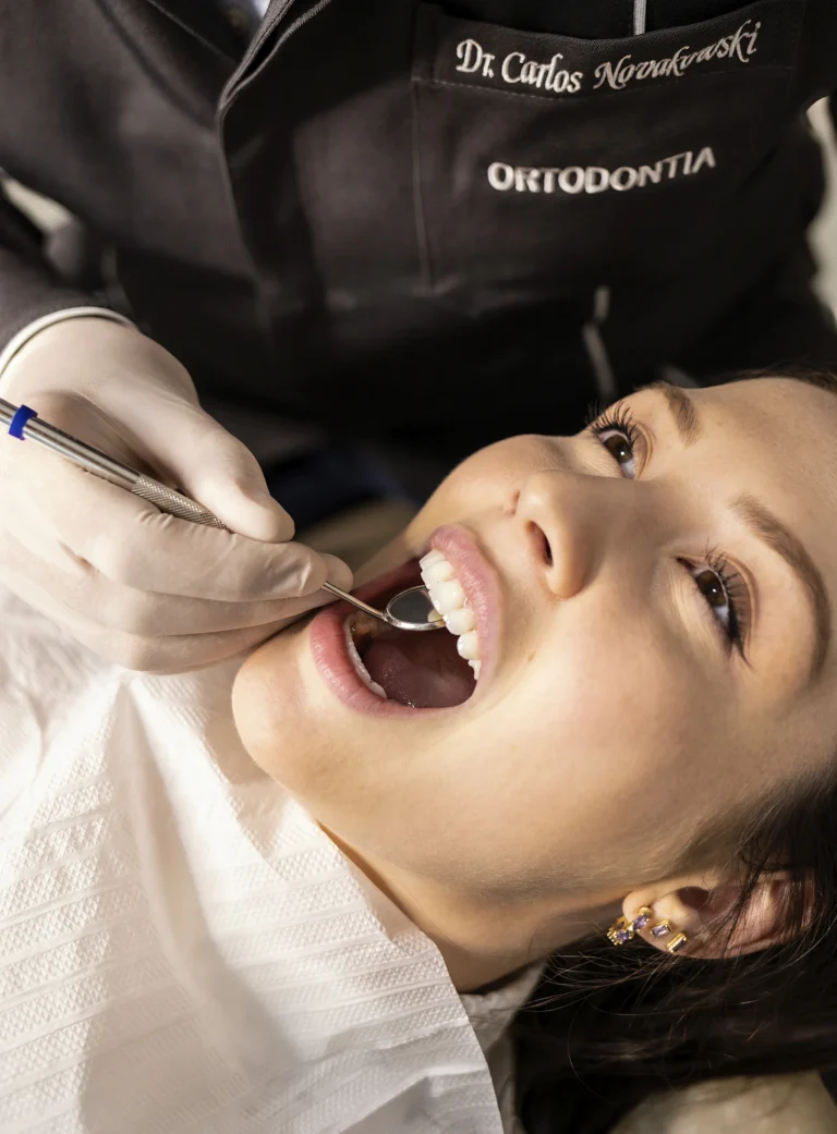 Orthodontic Referral Marketing: Dentists, Patients and the Rules 4 orthodontist examining a patient the consultation an
